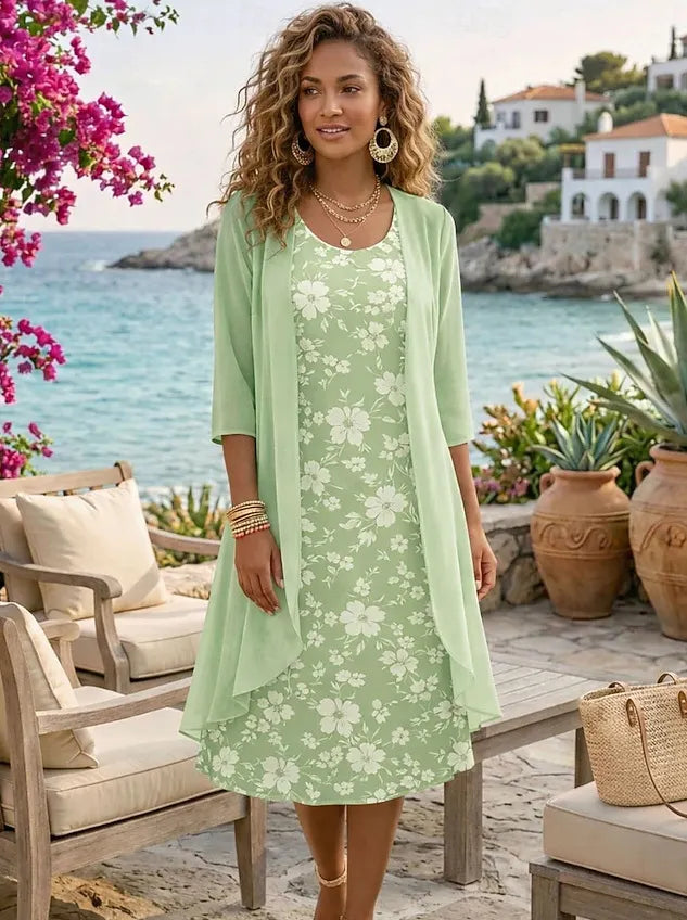 Elegante conjunto de duas peças para mulher, composto por um vestido de chiffon e um casaco de malha.